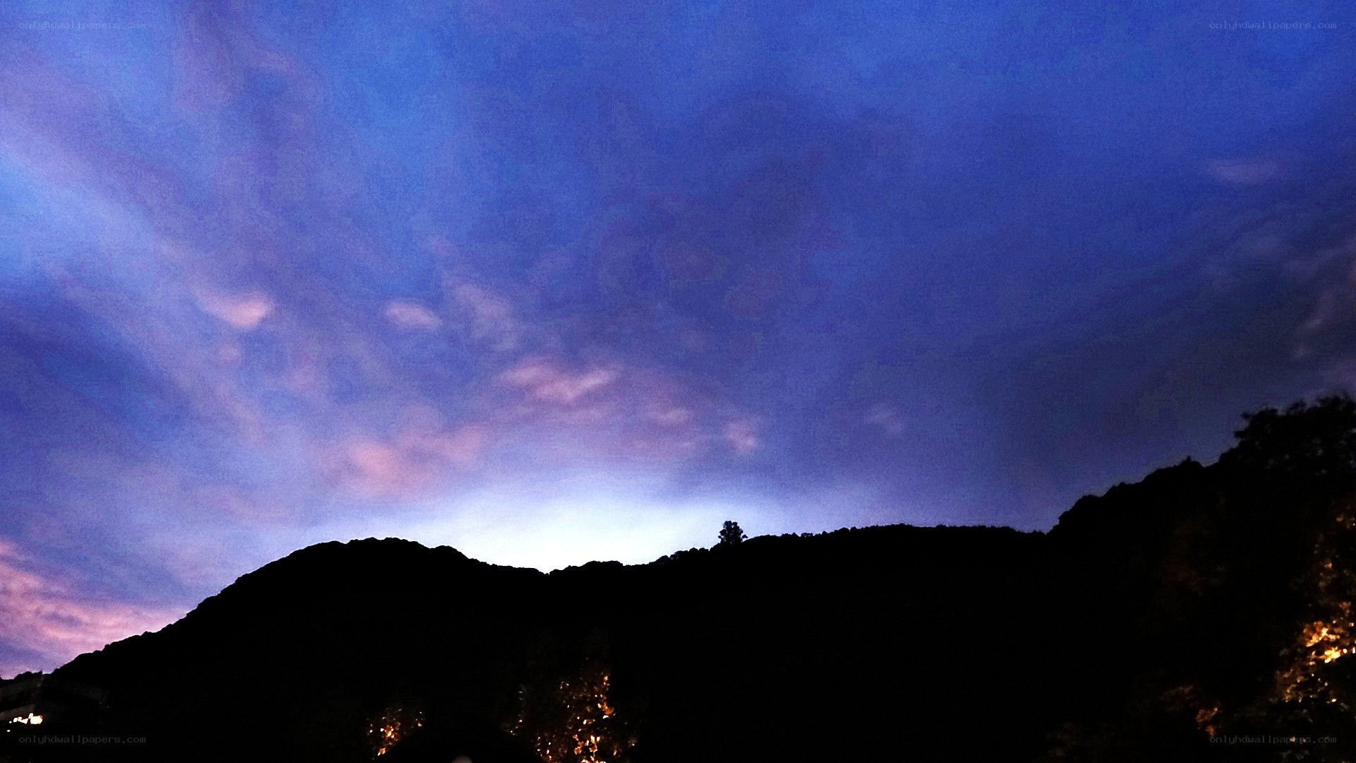 Twilight sky over silhouetted hills