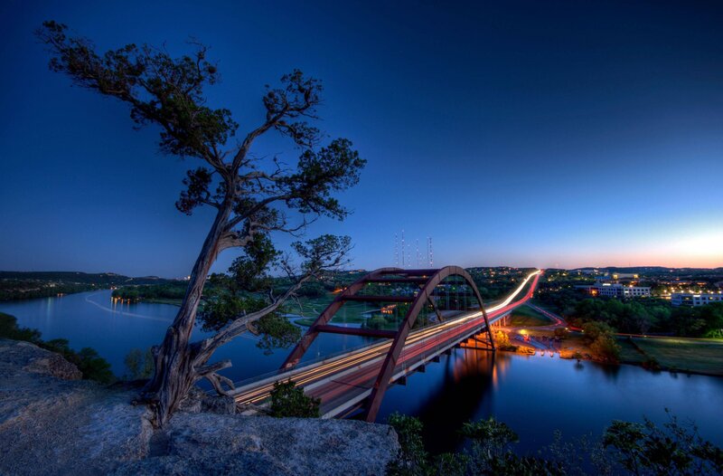 Twilight view of a bridge over river