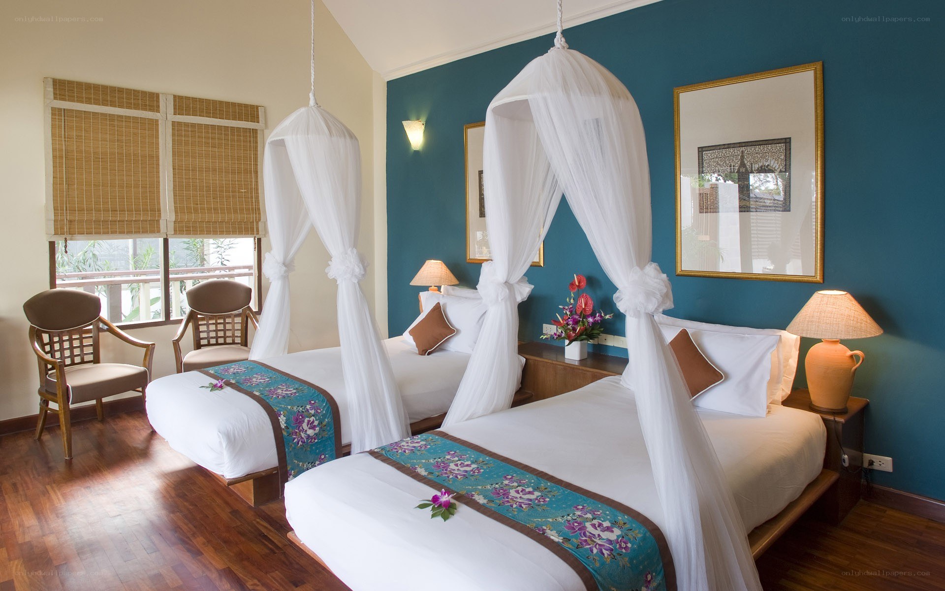 twin beds with mosquito nets