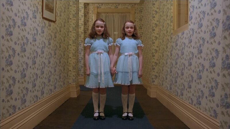twin girls in hallway