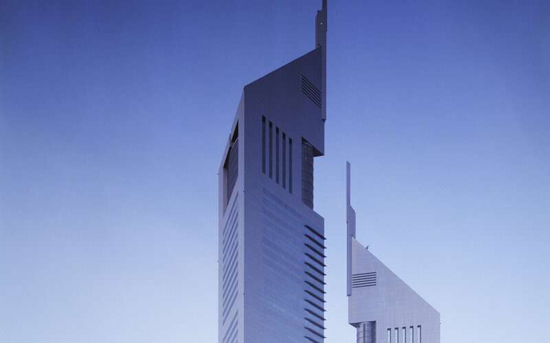 twin skyscrapers against blue sky