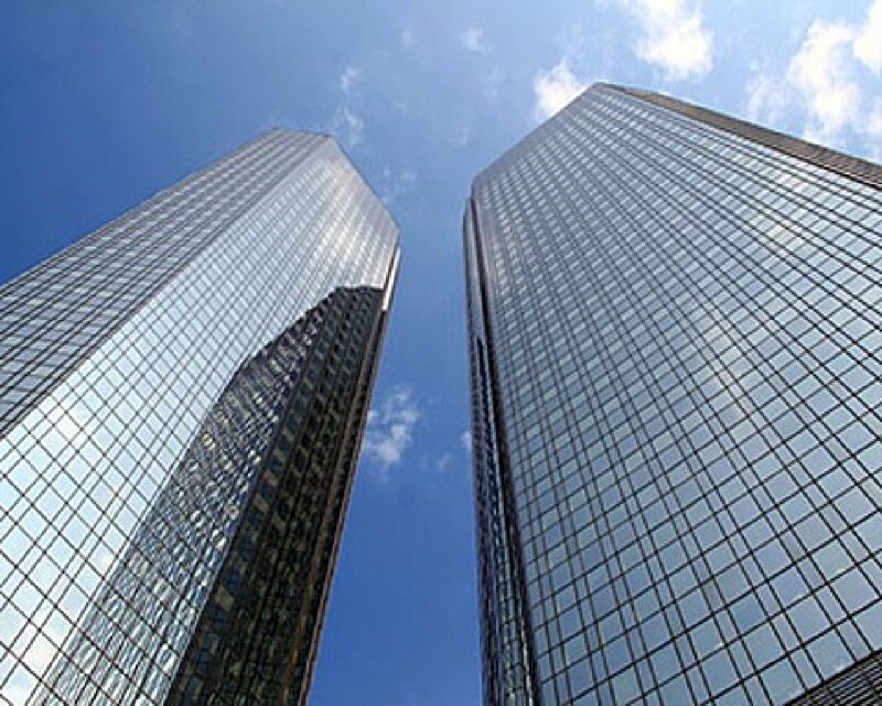 twin skyscrapers against blue sky