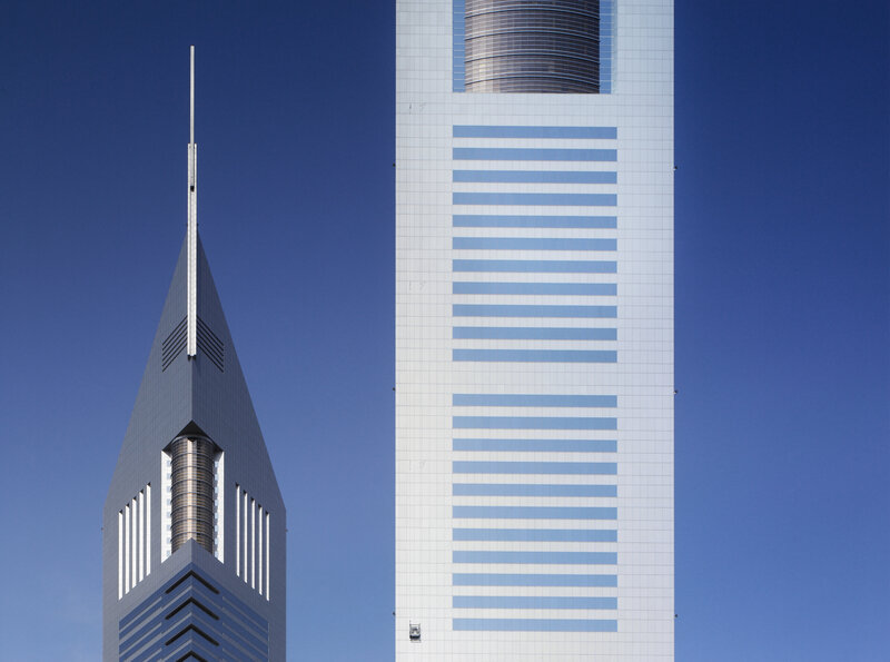 twin skyscrapers against blue sky