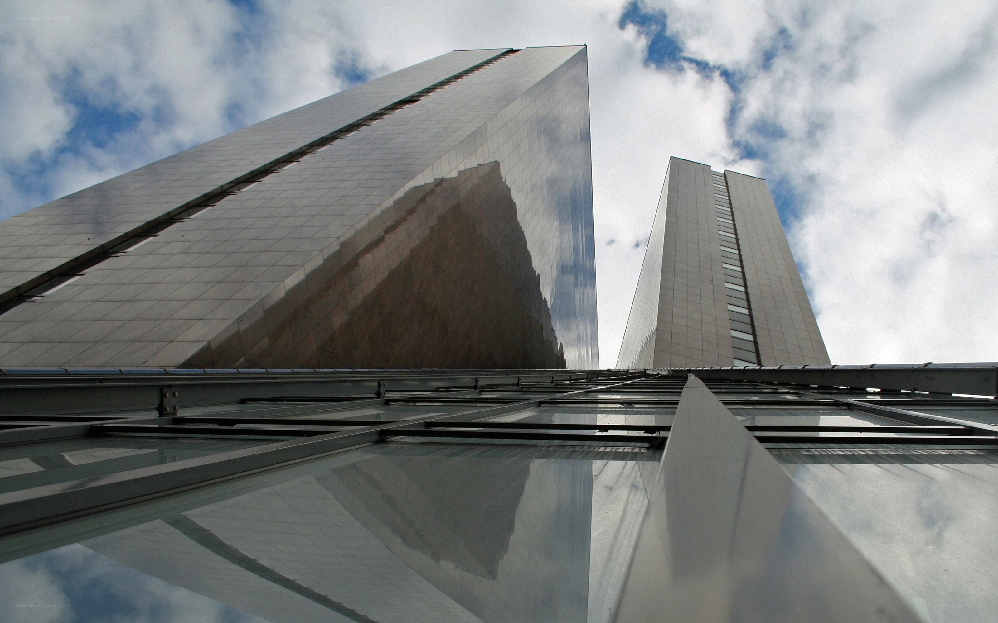 twin skyscrapers under cloudy sky