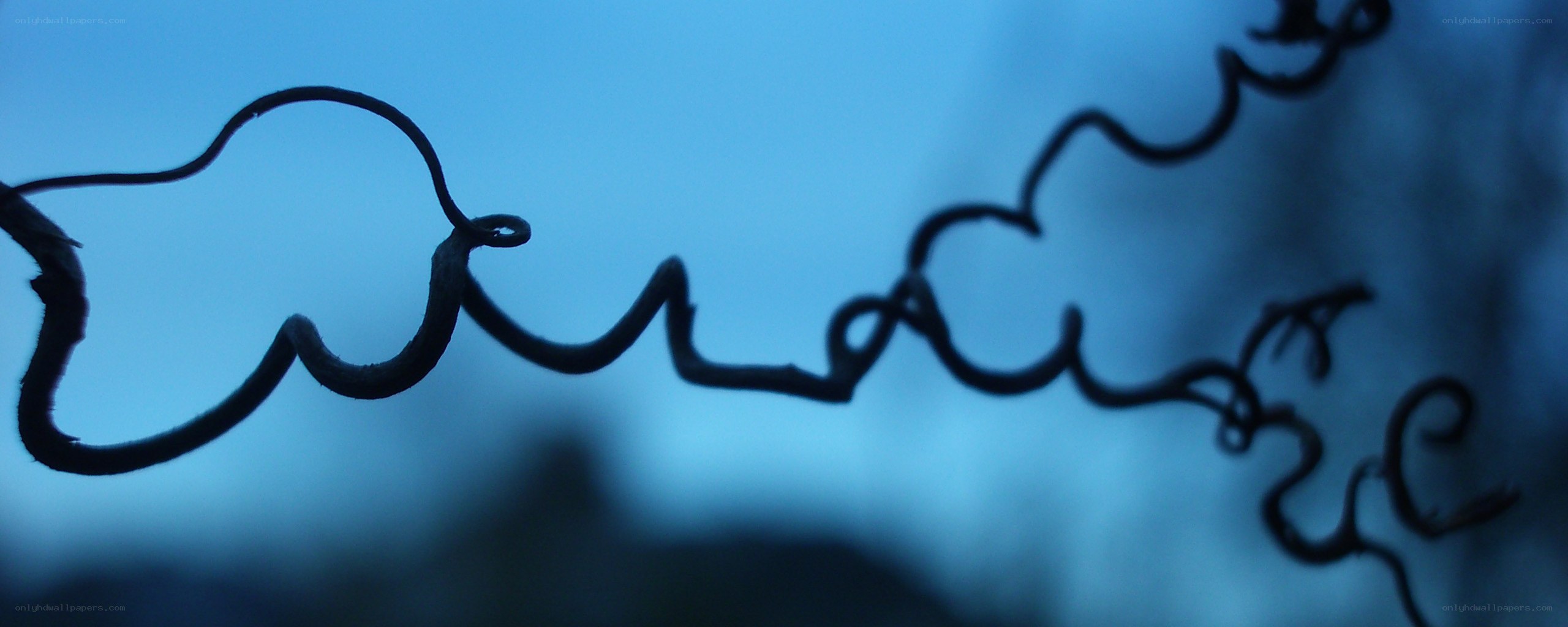 twisted wire against blue sky