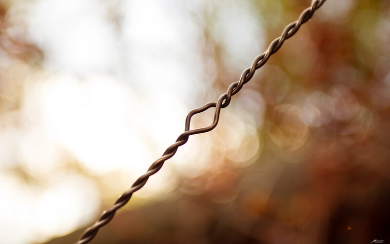 Twisted wire against bokeh background