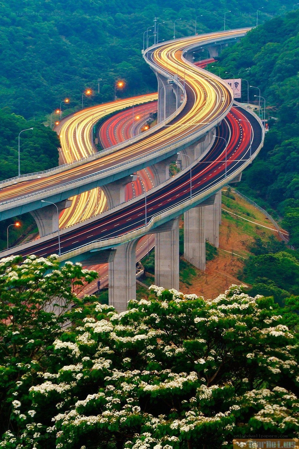 Twisting highway over green hills