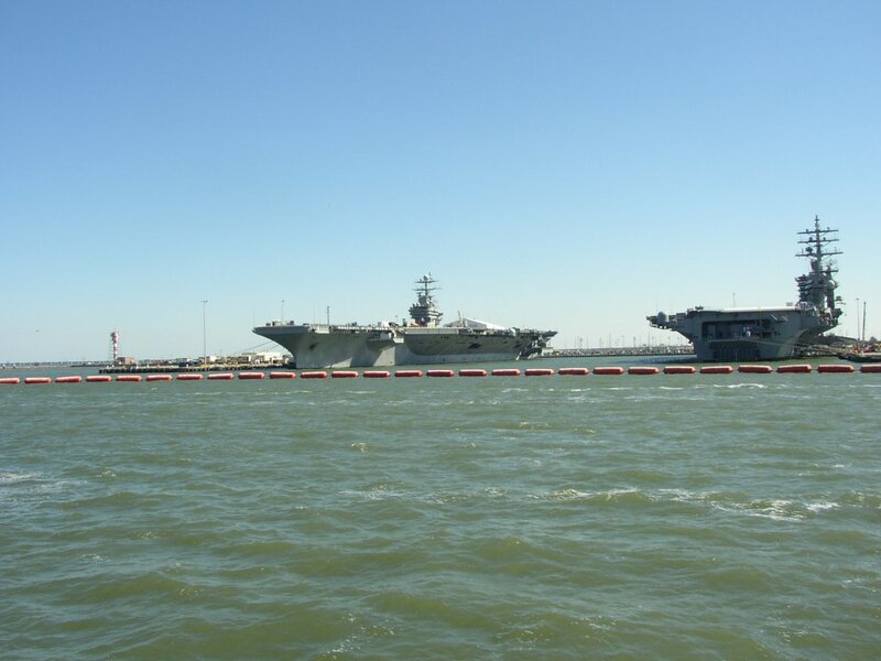 Two aircraft carriers in harbor