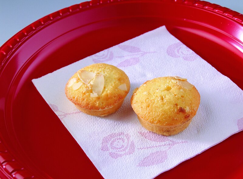 two almond muffins on a red plate