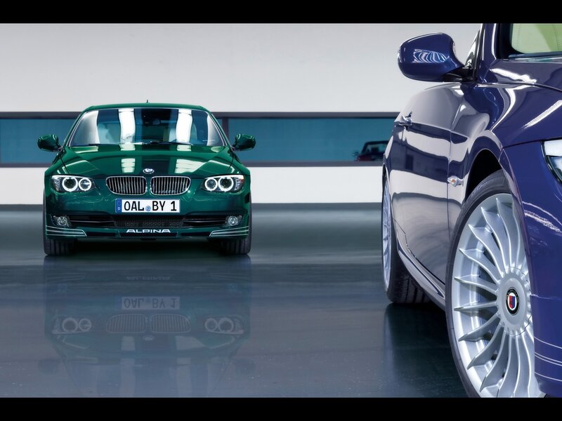 Two Alpina BMW cars in showroom