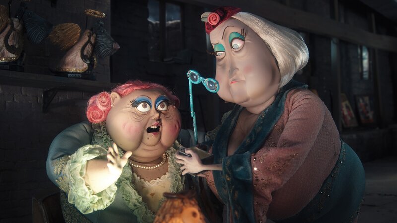 Two animated women in a workshop