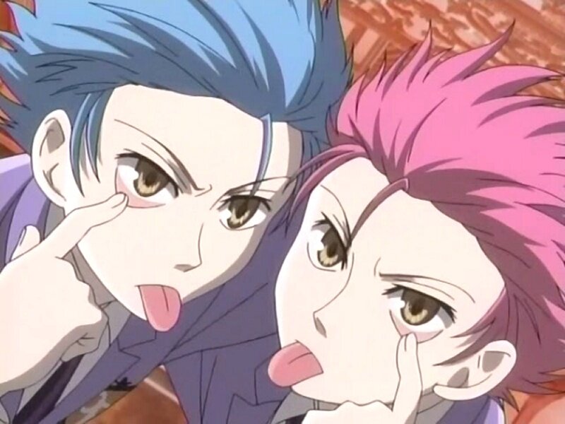 two anime characters making faces