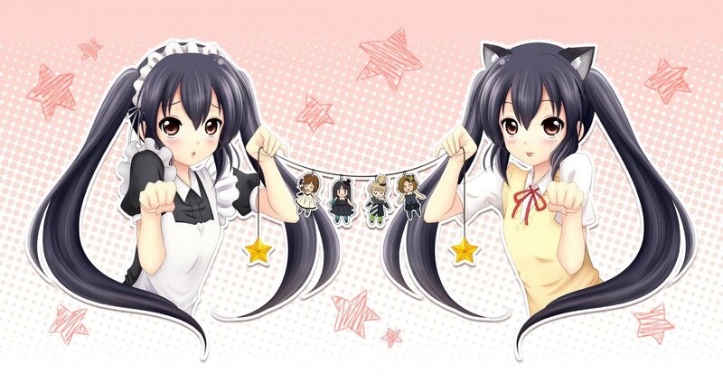 Two Anime Girls Holding Charms