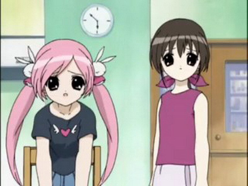 Two anime girls in a room