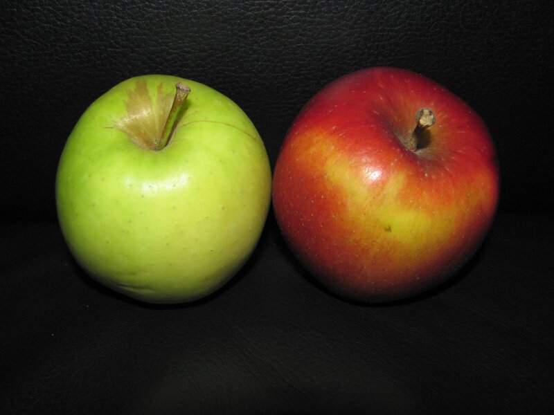 two apples on black surface