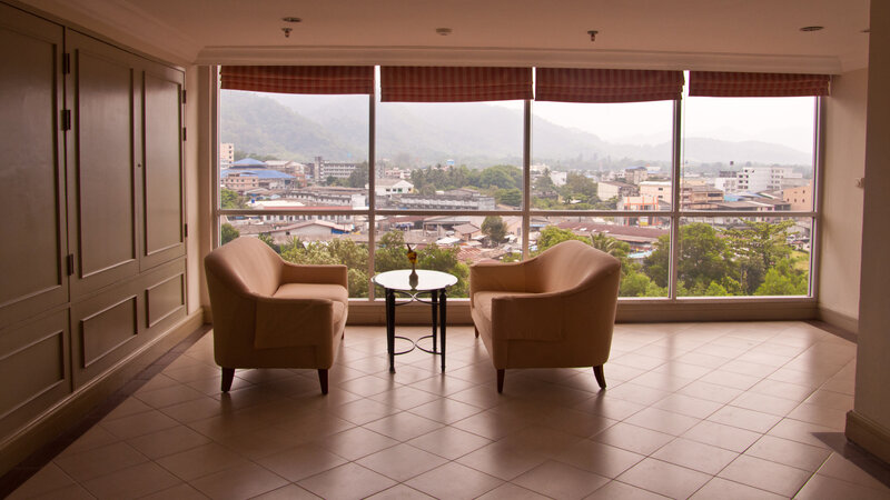 Two Armchairs by Window