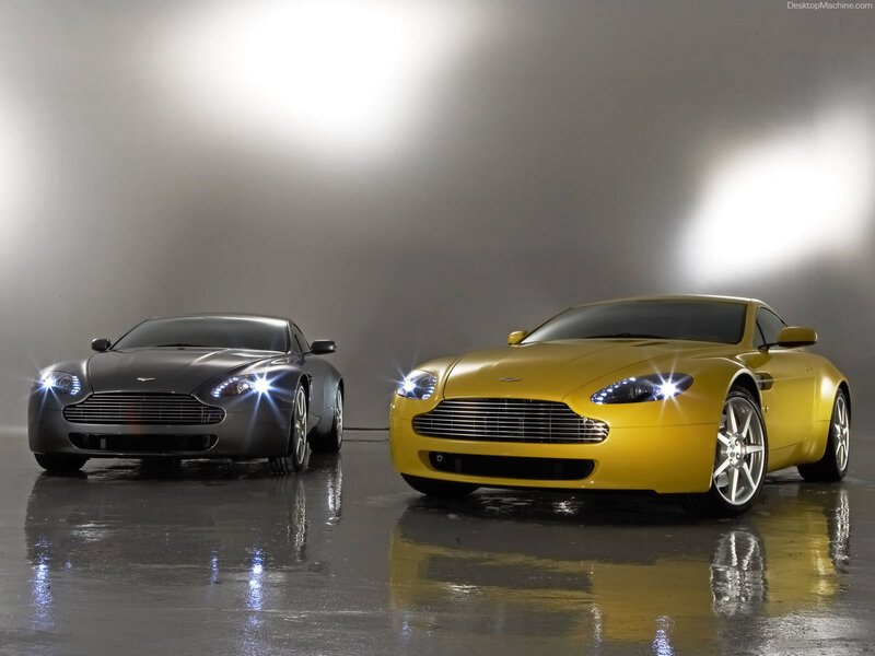 Two Aston Martin Cars — Yellow, Dramatic, Photograph