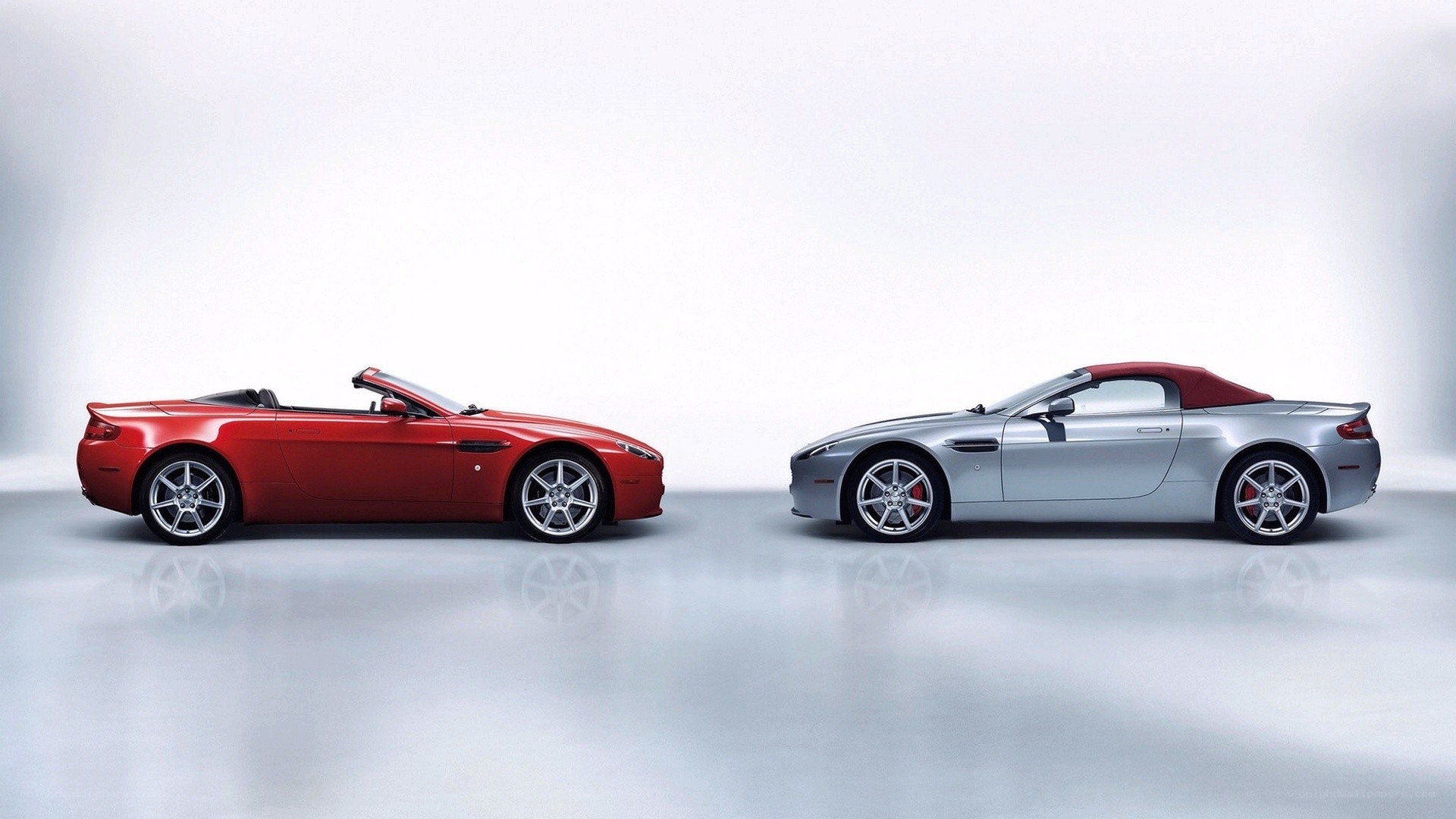 Two Aston Martin convertibles
