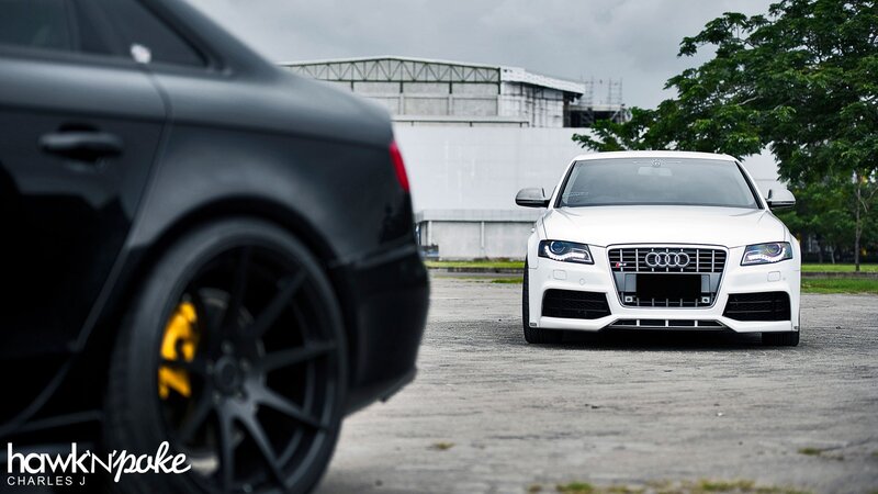 Two Audi cars in a parking lot
