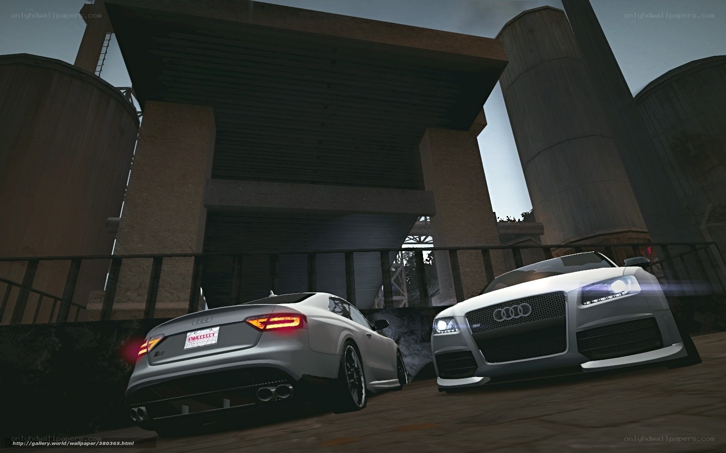 Two Audi cars in industrial setting