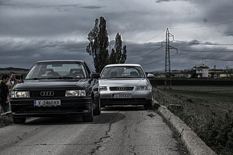 Two Audi Cars on Road — Gray