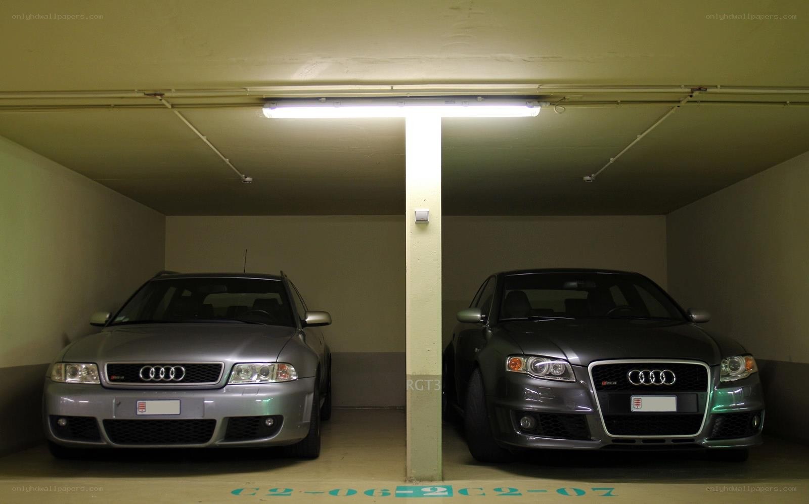 Two Audis in a garage