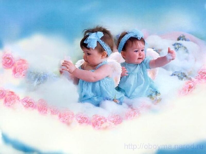 two babies as angels on clouds