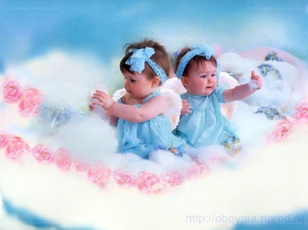 two babies as angels on clouds