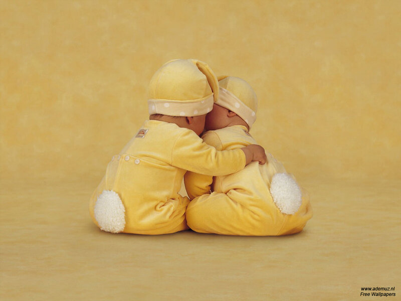 two babies hugging
