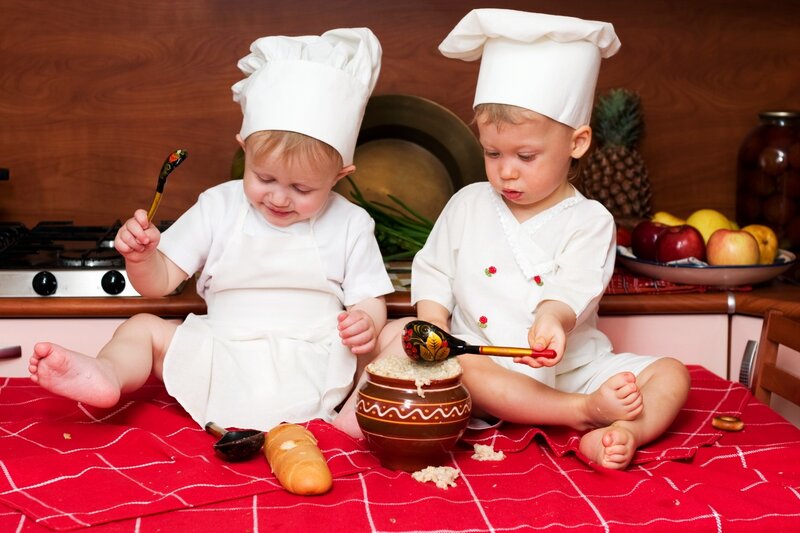Two babies in chef hats