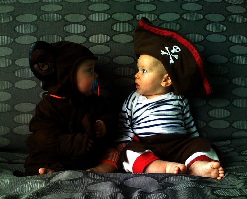 Two babies in costumes