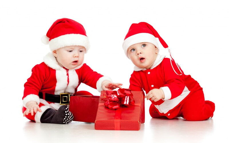 Two Babies in Santa Suits
