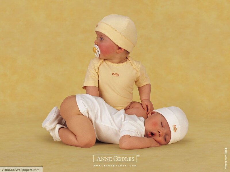 Two babies in yellow and white