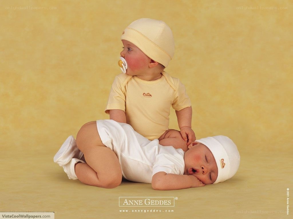 Two babies in yellow and white