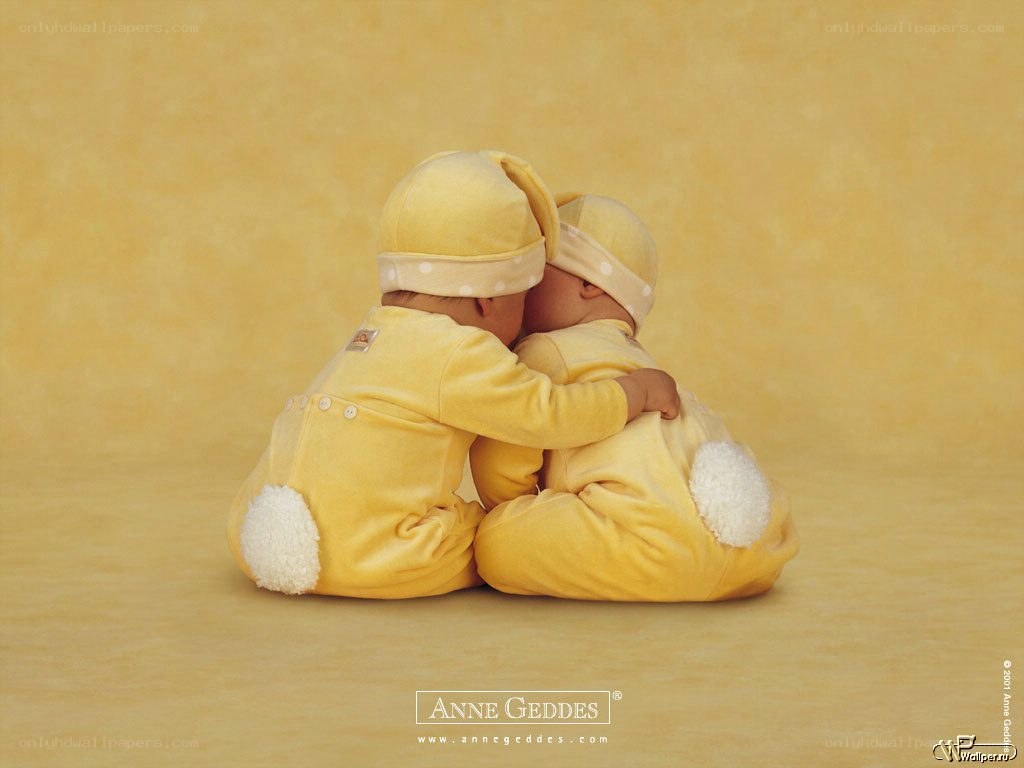 two babies in yellow bunnies