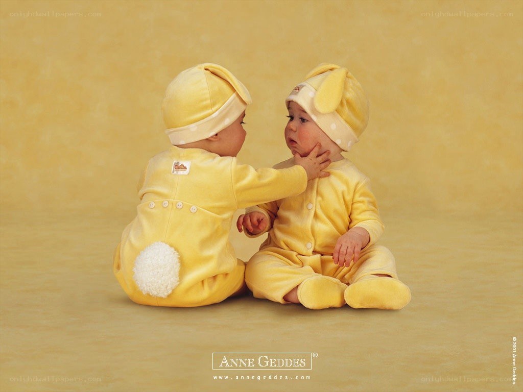 Two babies in yellow bunnies