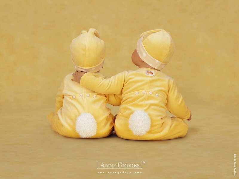 Two Babies in Yellow Suits