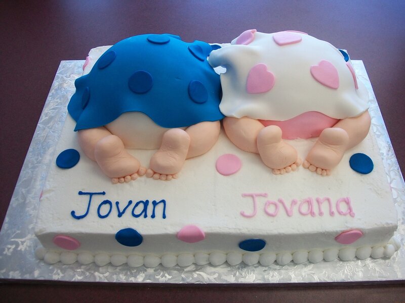 Two Baby Figurines on Cake