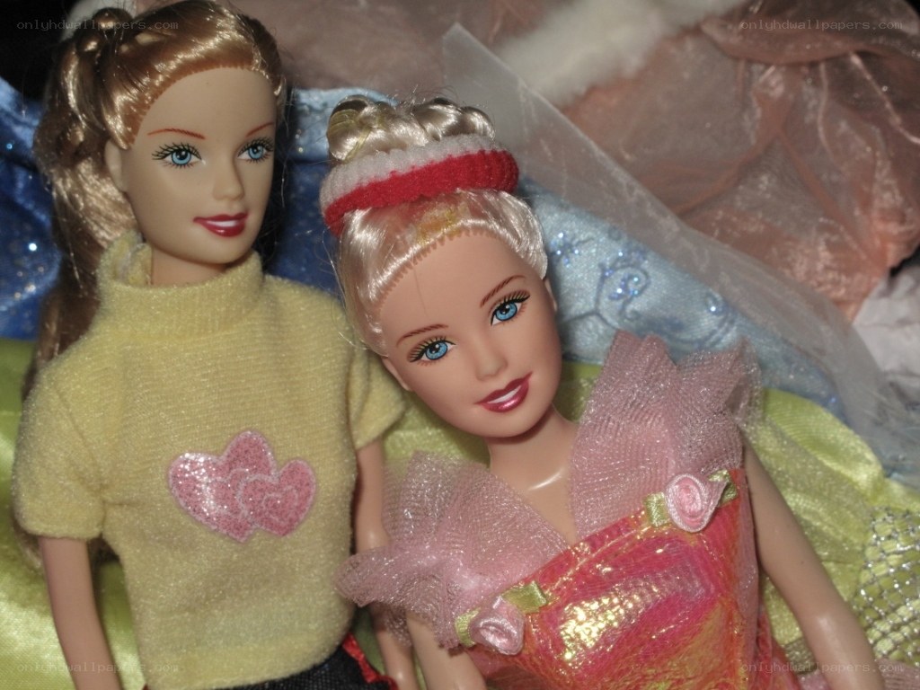 Two Barbie dolls together