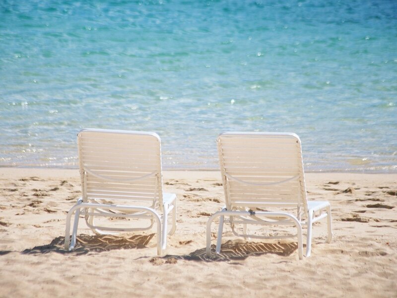 Two beach chairs on a sunny day