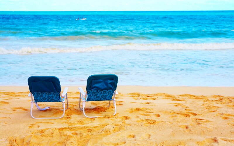 Two Beach Chairs on Sand