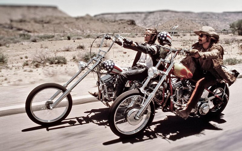 Two bikers on chopper motorcycles