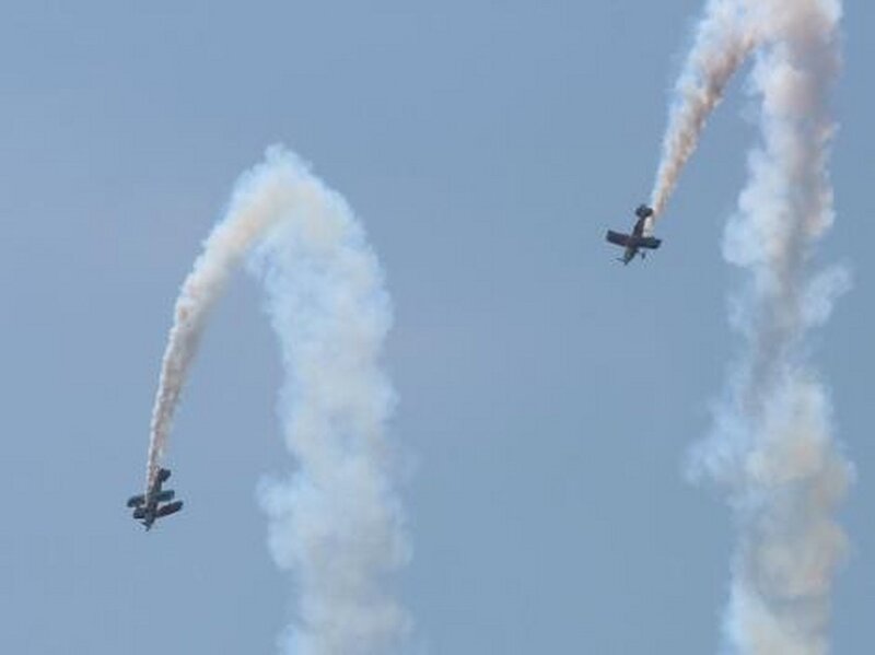 Two Biplanes Flying