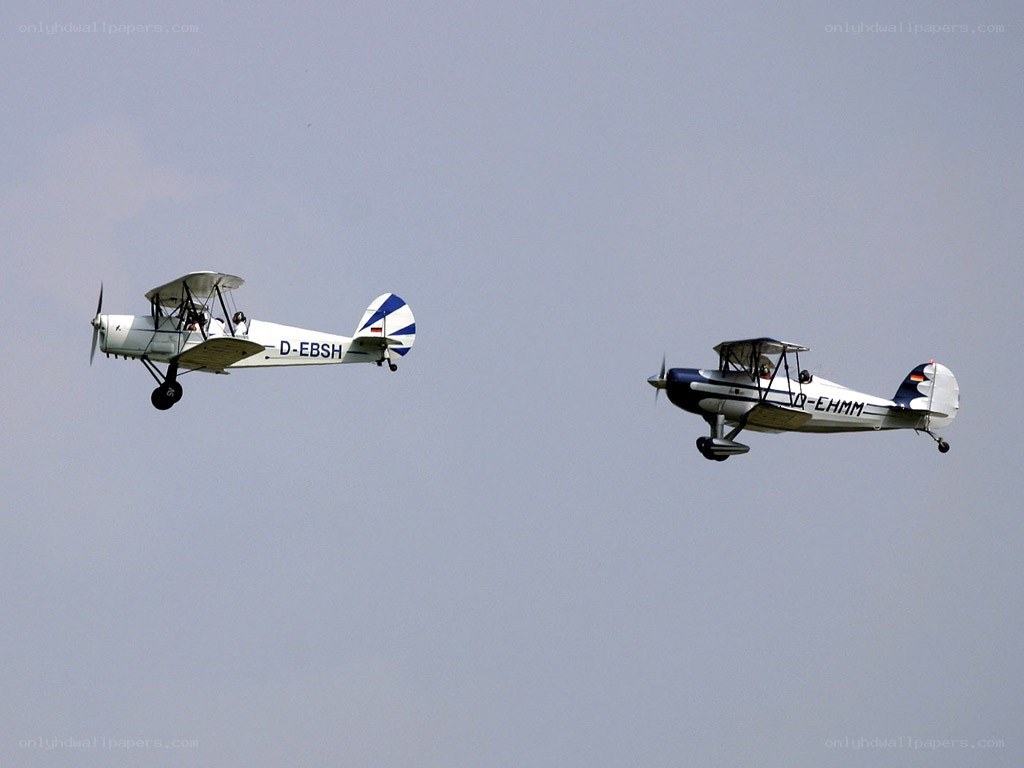 Two biplanes in flight