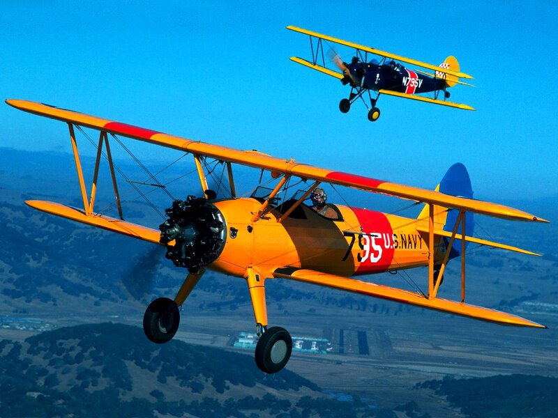 Two biplanes in flight