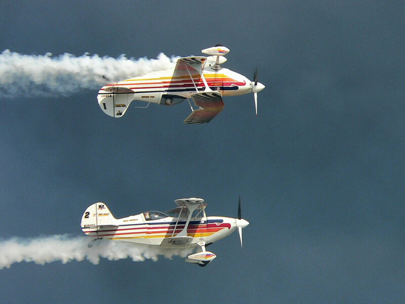 Two Biplanes in Flight — White