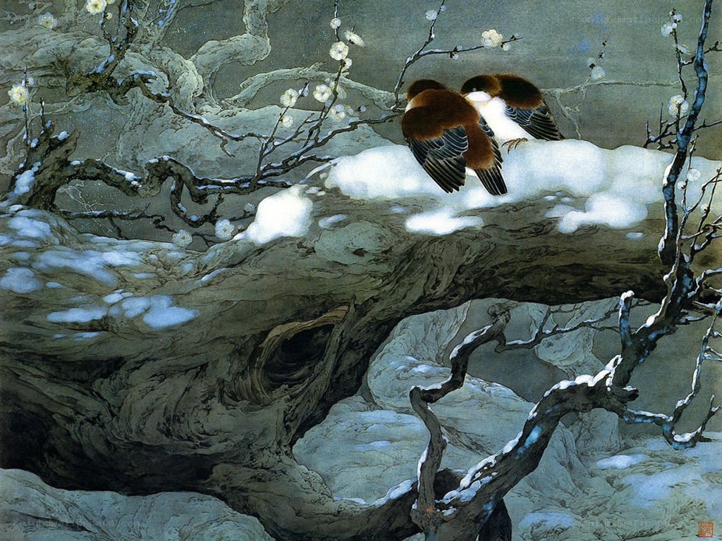 Two birds on a snowy branch