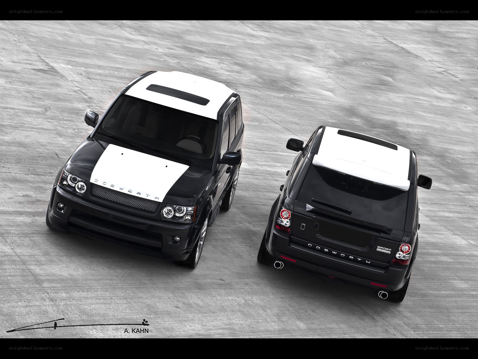 Two black and white Range Rovers