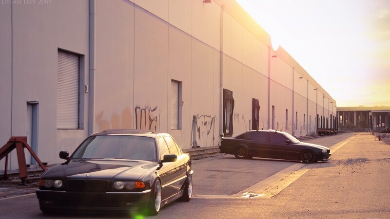 Two Black BMW Cars — Dramatic, Sunset