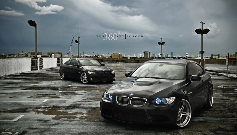 Two black BMWs on a rooftop